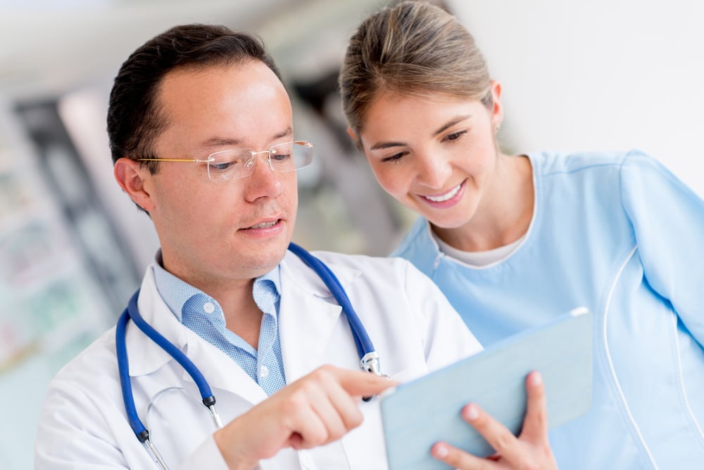 Doctor at the hospital talking to a nurse