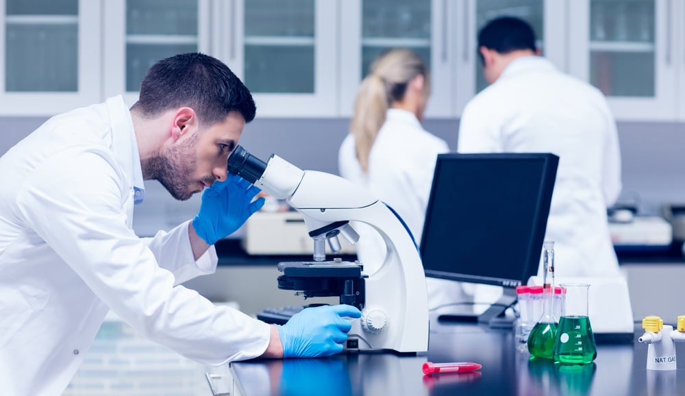 Scientist working with microscope in the lab at the university